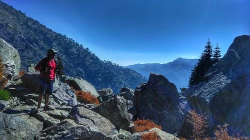 Rear view of man walking on mountain