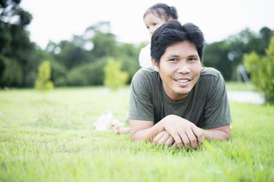 Young woman sitting on field