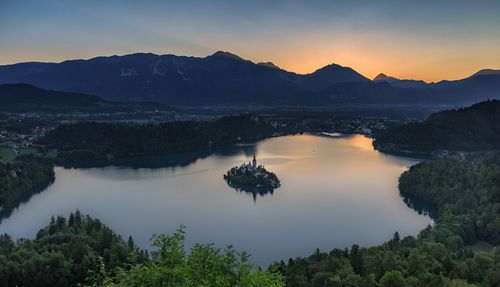 Scenic view of mountains against sky at sunset