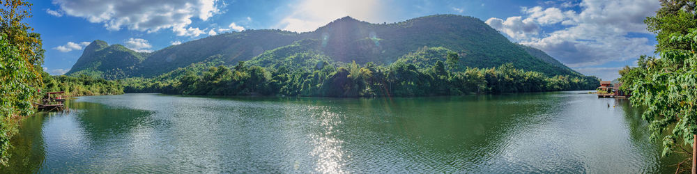 Panoramic view of river amidst mountains against sky