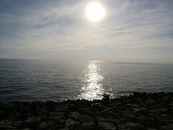 Scenic view of sea against sky at sunset