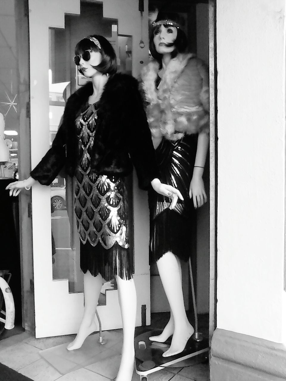 YOUNG WOMAN STANDING BY STORE IN SHOP