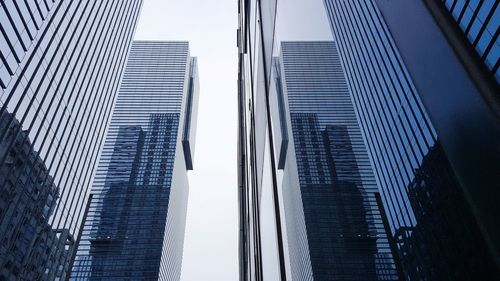 Low angle view of modern buildings against sky