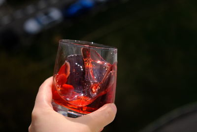 Close-up of hand holding wineglass