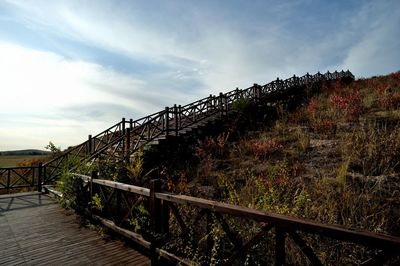 View of footbridge against sky