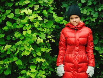 Portrait of beautiful young woman standing outdoors