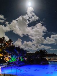 Scenic view of swimming pool against sky at night