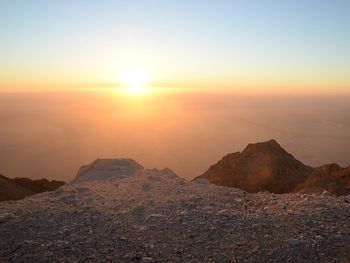 Scenic view of mountains against sky during sunset