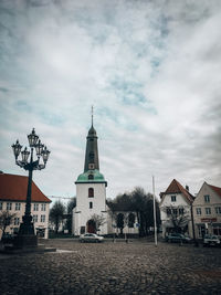 View of street and buildings against sky