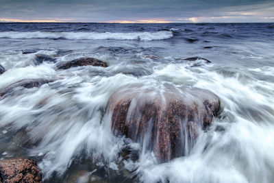 Close-up of wave in sea against sky