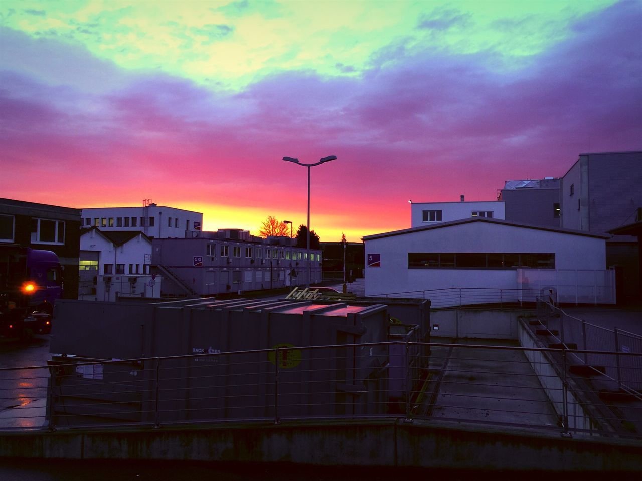 architecture, building exterior, built structure, sky, cloud - sky, sunset, cloudy, dramatic sky, cloud, orange color, weather, dusk, house, residential structure, overcast, residential building, building, storm cloud, outdoors, city