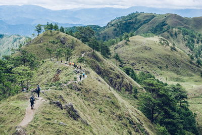 High angle view of people walking on mountain