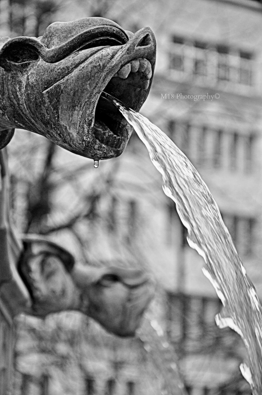 focus on foreground, close-up, day, outdoors, selective focus, part of, art and craft, creativity, statue, old, side view, cropped, art, nature, holding, sculpture, incidental people, rope