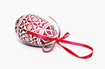 High angle view of red decoration on white background