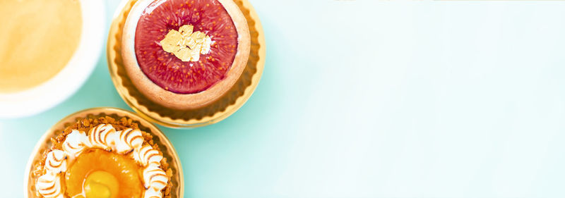 High angle view of cake against white background