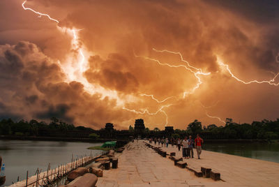 Panoramic view of lightning over lake
