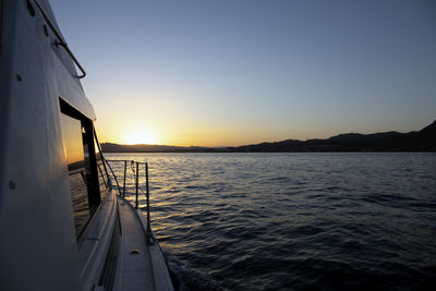 Scenic view of sea against clear sky during sunset