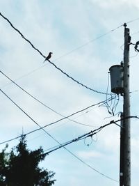 Low angle view of electricity pylon