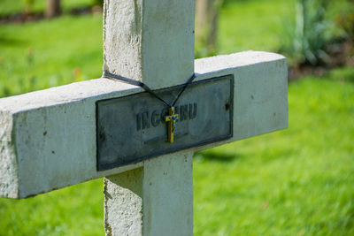 Close-up of cross on grass