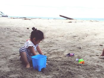 Boy with toy on beach