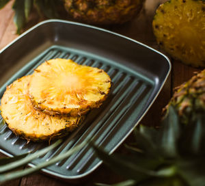 Close-up of pineapple slices in cooking pan