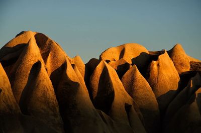 Close-up of rocks against clear sky