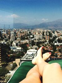 Man relaxing in front of cityscape