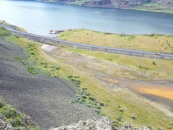 High angle view of river by road against sky