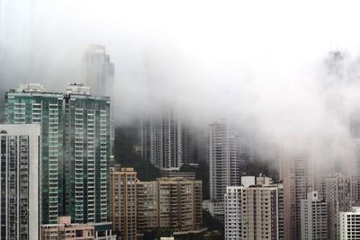 Skyscrapers covered with fog