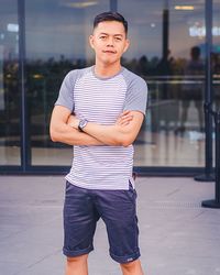 Portrait of a young man standing outdoors