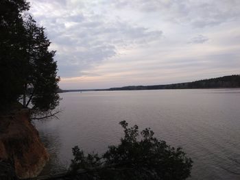 Scenic view of lake against sky during sunset