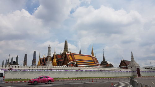 View of temple building against cloudy sky