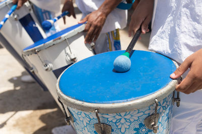 Musicians from the group filhos de gandhy are seen playing percussion 