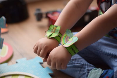 Midsection of woman playing with toy