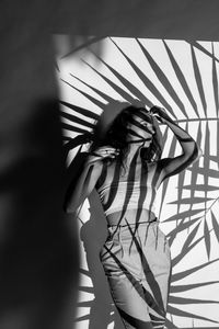 Woman standing against wall