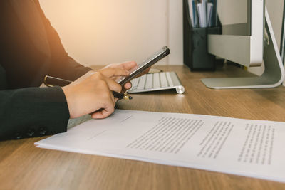 Man using laptop on table at home