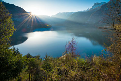 Scenic view of lake and mountains against sky