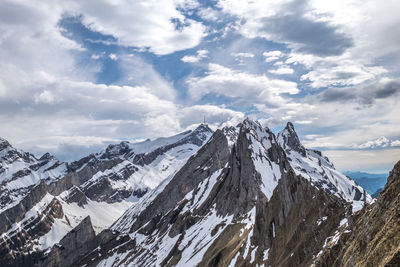 Panoramic view of snowcapped mountains against sky