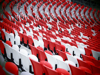 Empty seats arranged in stadium