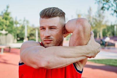 Young man exercising in park