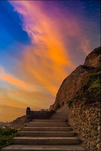 steps, sky, sunset, the way forward, staircase, tranquility, cloud - sky, steps and staircases, scenics, orange color, beauty in nature, tranquil scene, railing, nature, mountain, cloud, rock - object, built structure, idyllic, outdoors