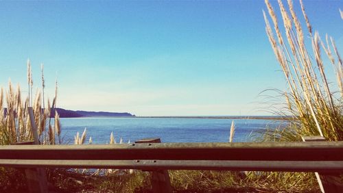 Scenic view of sea against blue sky