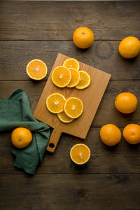 Orange fruits on cutting board