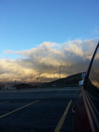 Road passing through dramatic sky