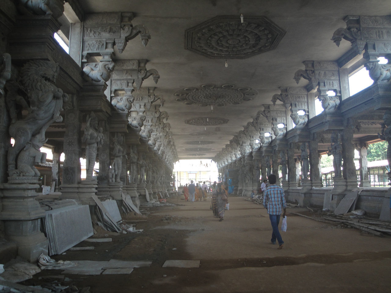 PEOPLE WALKING IN A CORRIDOR OF A BUILDING