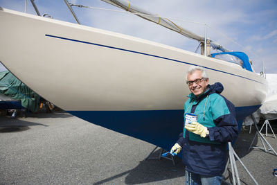 Man painting boat