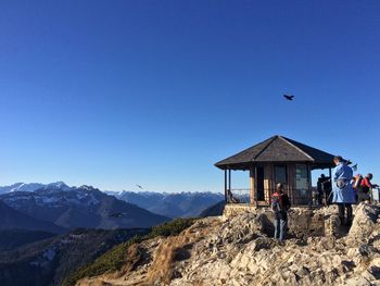 Scenic view of mountains against clear blue sky