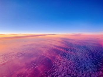 Aerial view of landscape against sky during sunset