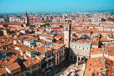 Sunny day in verona, italy. view from above on old town red roofs, square, streets and landmarks.