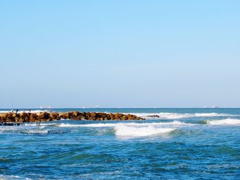 Scenic view of sea against clear sky